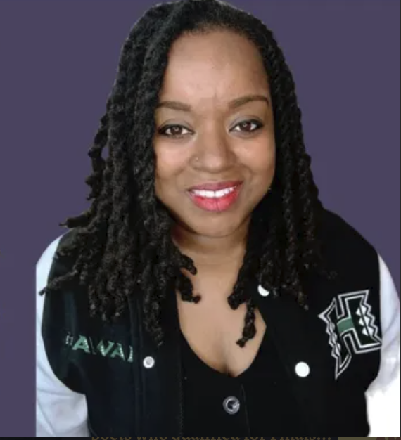 DJ Wanderlust smiling in a Hawaii letterman jacket